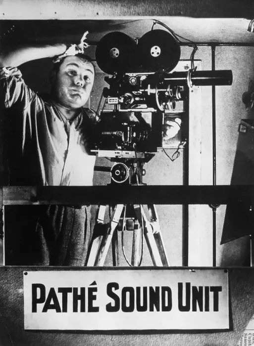 Framed Print : Phew !. circa 1930: A camera operator in a Pathe News studio in London is suffering Framed Print : Phew !. circa 1930: A camera operator in a Pathe News studio in London is suffering