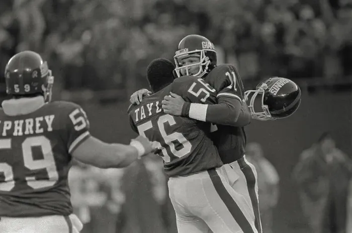 Framed Print : Phil Simms and Lawrence Taylor in a Winning Moment Framed Print : Phil Simms and Lawrence Taylor in a Winning Moment