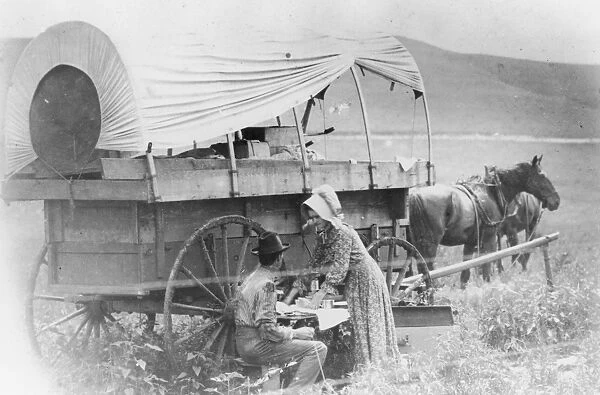 Wagon. A Photograph of a Couple Stopping for a Rest Beside their Wagon circa 1890
