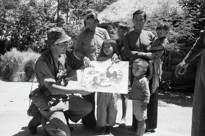 Framed Print : Photographer Kyoichi Sawada Presenting Prize Winning Photo to Villagers