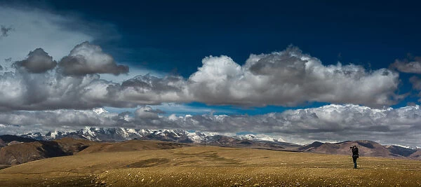 Photographer shooting with Himalayas background