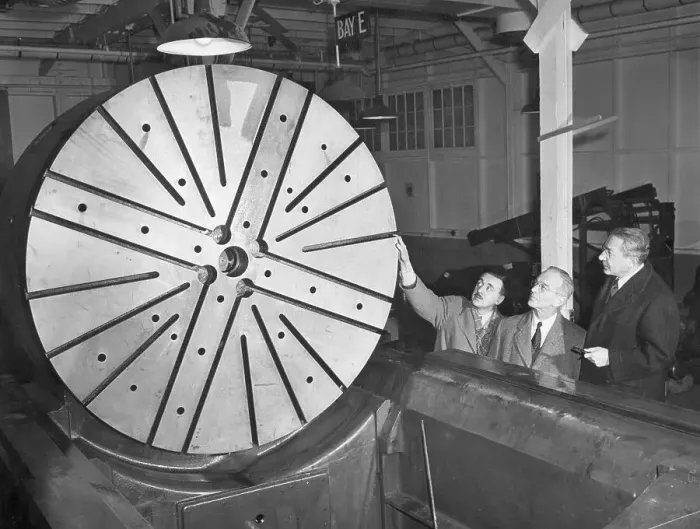 Framed Print : Physicists Looking at the Grinder of a Cyclotron Framed Print : Physicists Looking at the Grinder of a Cyclotron