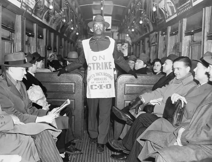 Framed Print : Picketer with Sign Walks Through Transit Car Framed Print : Picketer with Sign Walks Through Transit Car
