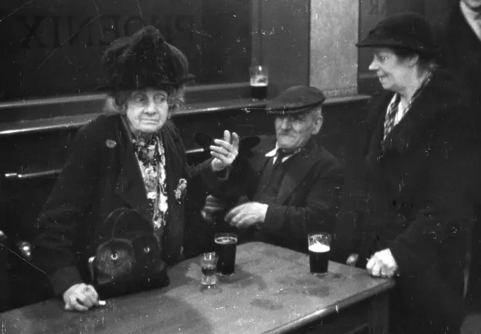 Framed Print : Pubs. Elderly people having a drink in a public house