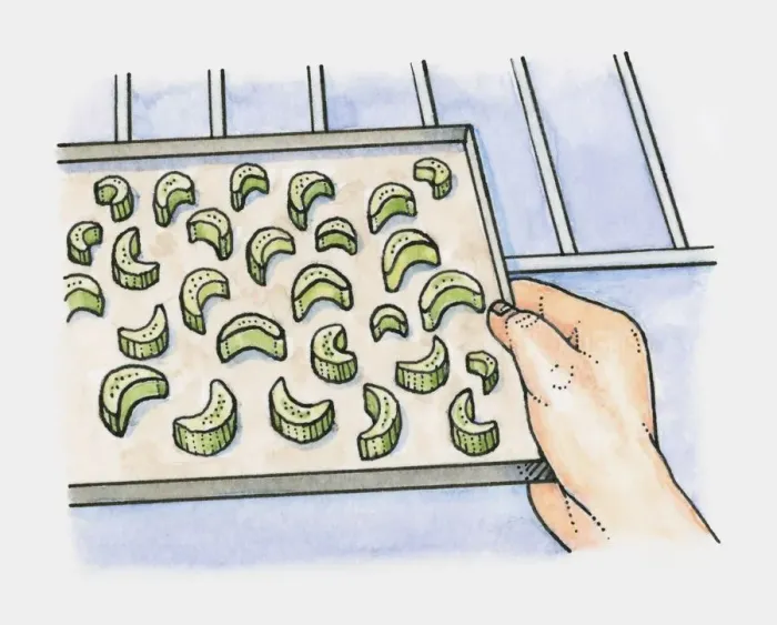 Framed Print : Pieces of celery on a baking tray being placed in the oven Framed Print : Pieces of celery on a baking tray being placed in the oven