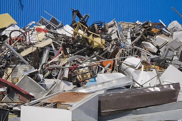 Pile of discarded household and industrial items at a scrap metal recycling centre, Quebec, Canada