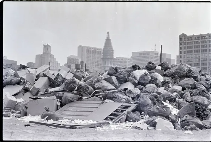 Framed Print : Pile Of Garbage W / City Buildings In Back Framed Print : Pile Of Garbage W / City Buildings In Back