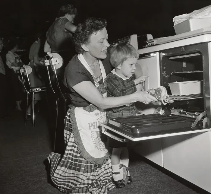 Framed Print : Pillsbury Finalist with Young Daughter Looking in Oven Framed Print : Pillsbury Finalist with Young Daughter Looking in Oven