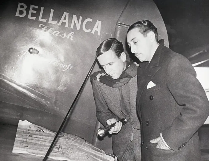 Framed Print : Pilots Reading Newspaper on the Wing of a Plane Framed Print : Pilots Reading Newspaper on the Wing of a Plane