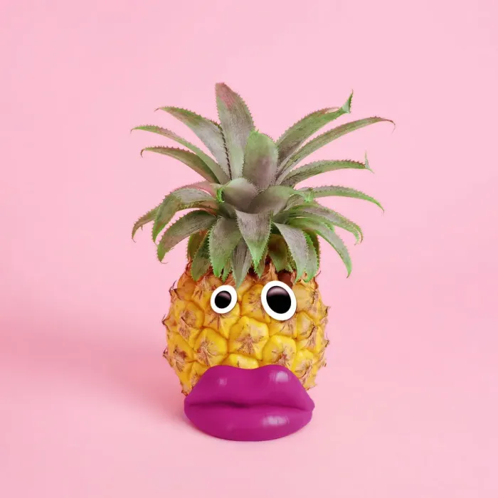 Framed Print : pineapple with face made of fake lips and googly eyes Framed Print : pineapple with face made of fake lips and googly eyes