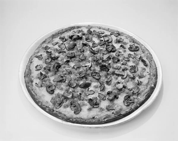 Pizza with mushrooms topping on white background, close-up