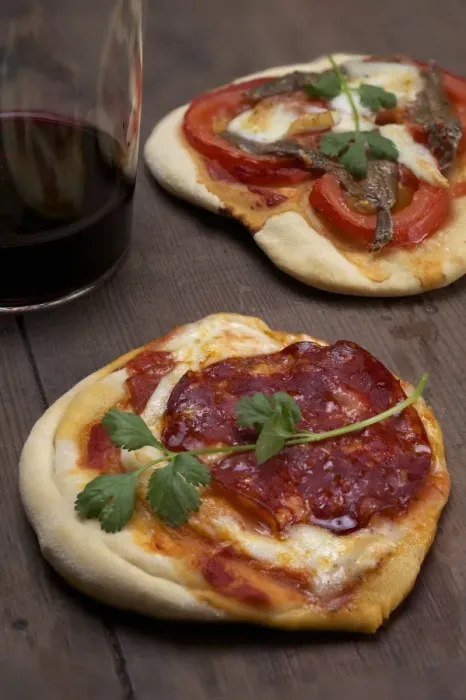 Framed Print : Pizzette, small pizzas with buffalo mozzarella, chorizo and coriander, front, and tomatoes and anchovies, rear Framed Print : Pizzette, small pizzas with buffalo mozzarella, chorizo and coriander, front, and tomatoes and anchovies, rear