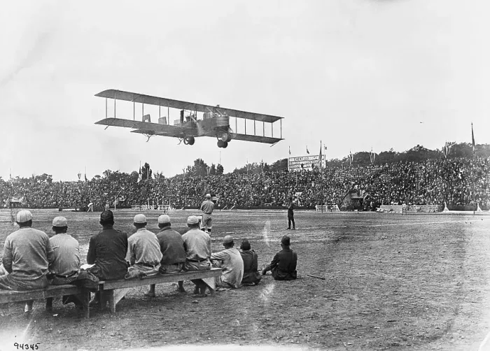 Framed Print : Plane Flying Over Stadium Framed Print : Plane Flying Over Stadium