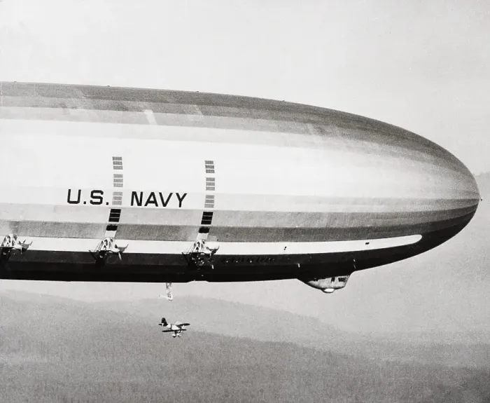 Framed Print : Plane Underneath Huge Dirigible in Flight Framed Print : Plane Underneath Huge Dirigible in Flight
