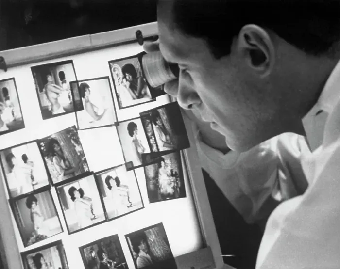 Framed Print : Playboy Publisher Hugh Hefner Observing Photographs Framed Print : Playboy Publisher Hugh Hefner Observing Photographs