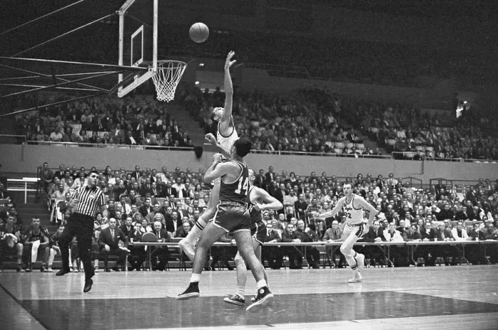 Framed Print : Player Going to Block Bob Cousy's Shot