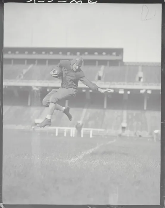 Framed Print : Player Soaring Through Air with Football Framed Print : Player Soaring Through Air with Football