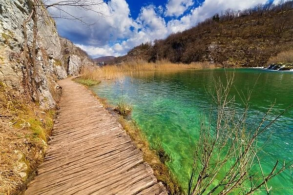 Plitvice Lakes boardwalk by water, spring day