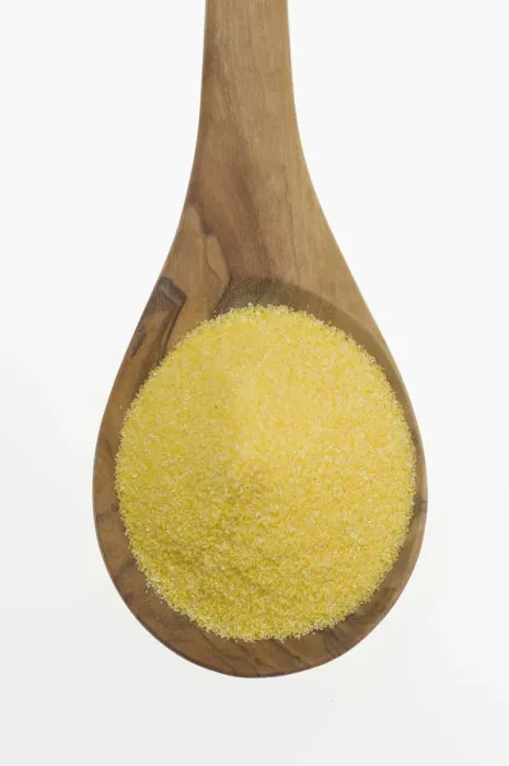 Framed Print : Polenta, cornmeal on an olive wood spoon Framed Print : Polenta, cornmeal on an olive wood spoon