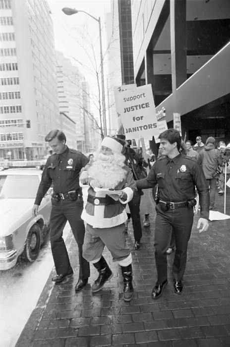 Framed Print : Police Arresting Santa Claus Framed Print : Police Arresting Santa Claus