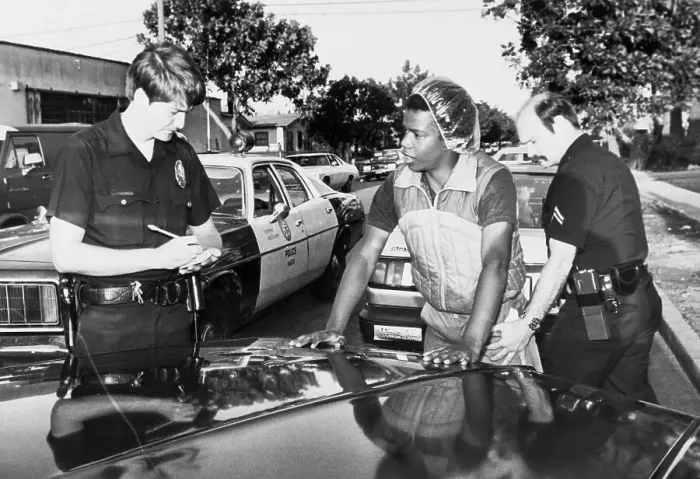 Framed Print : Police Checking out Gang Member for Concealed Items Framed Print : Police Checking out Gang Member for Concealed Items
