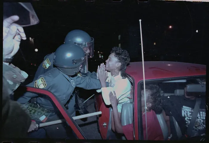 Framed Print : Police Confronting Arrested Female from Patrol Car Framed Print : Police Confronting Arrested Female from Patrol Car