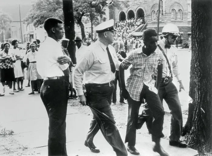 Framed Print : Police Escorting Demonstrator to Jail Framed Print : Police Escorting Demonstrator to Jail