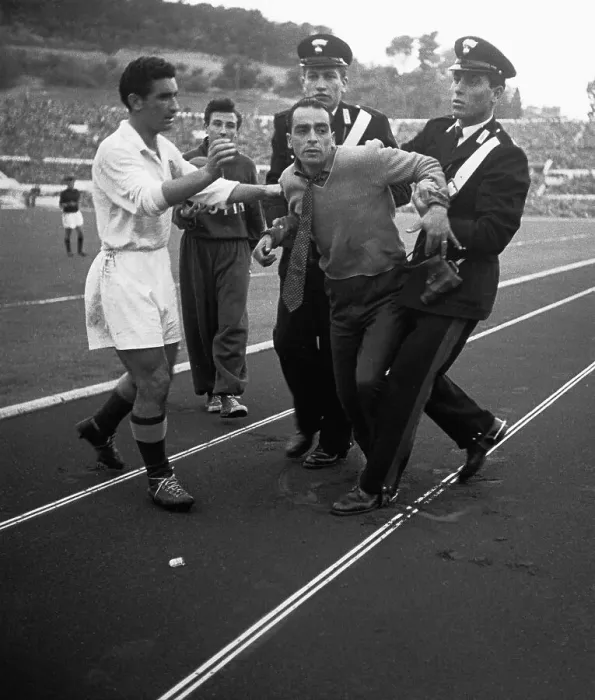 Framed Print : Police Escorting a Man Off of a Soccer Field Framed Print : Police Escorting a Man Off of a Soccer Field