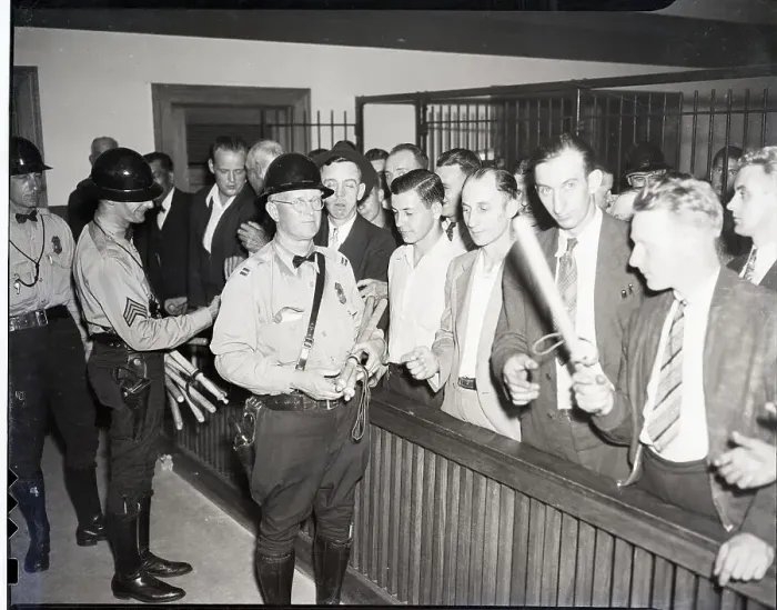 Framed Print : Police Giving Clubs to Vigilantes Framed Print : Police Giving Clubs to Vigilantes