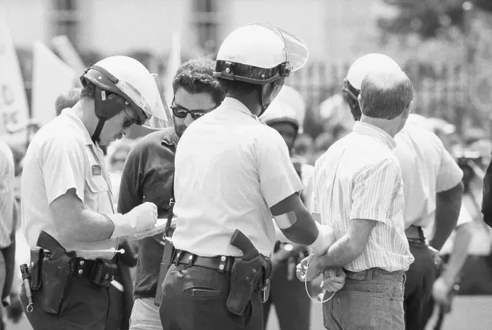 Framed Print : Police Handcuffing a Protester Framed Print : Police Handcuffing a Protester