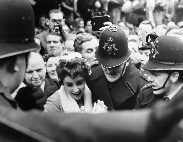 Framed Print : Police Help Liz Taylor Through Crowd Framed Print : Police Help Liz Taylor Through Crowd