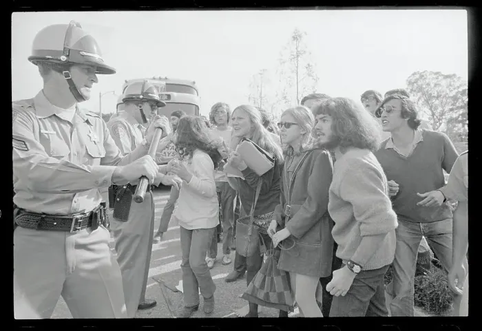 Framed Print : Police Holding Back Young Protesters Framed Print : Police Holding Back Young Protesters