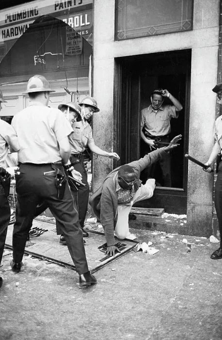 Framed Print : Police Kicking Fallen Man Framed Print : Police Kicking Fallen Man