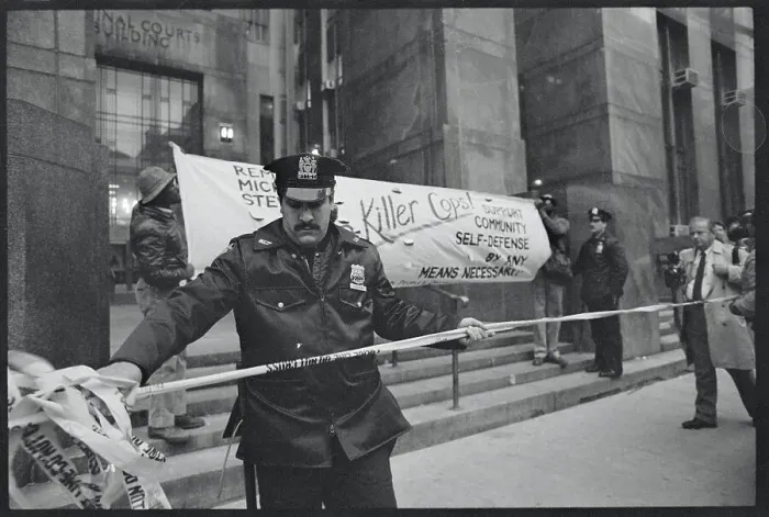 Framed Print : Police Officer Cordoning a Building Entrance Framed Print : Police Officer Cordoning a Building Entrance