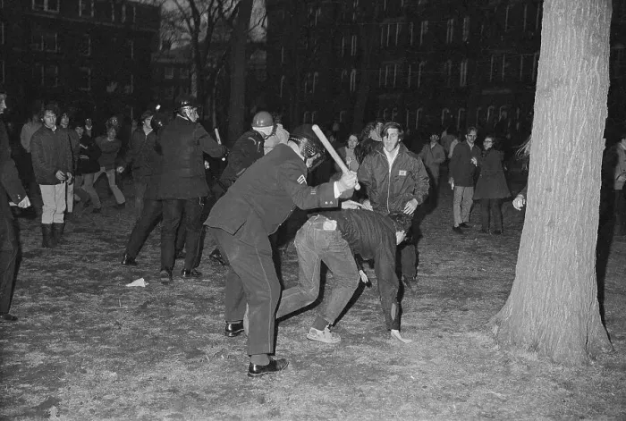 Framed Print : Police Officer Hitting Student at Protest Framed Print : Police Officer Hitting Student at Protest