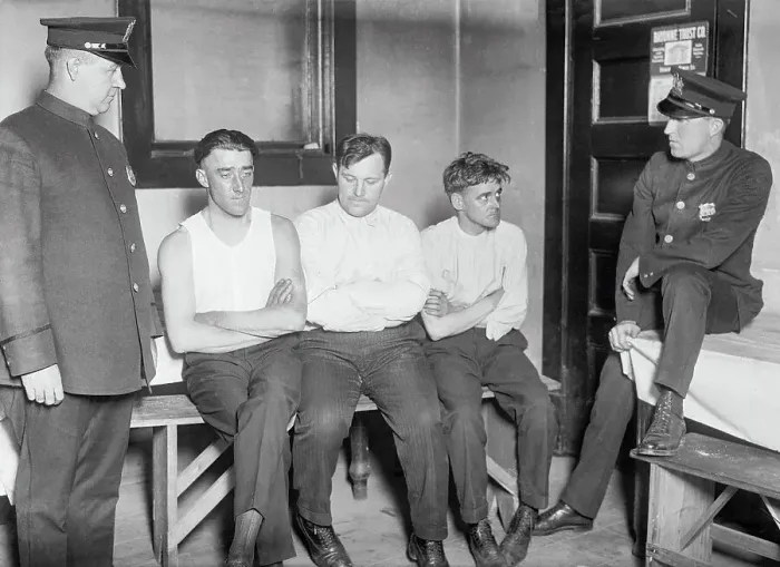 Framed Print : Police Officers Guarding Prisoners Framed Print : Police Officers Guarding Prisoners