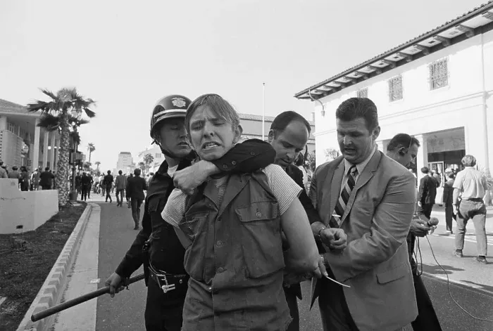 Framed Print : Police Restraining a Demonstrator Framed Print : Police Restraining a Demonstrator