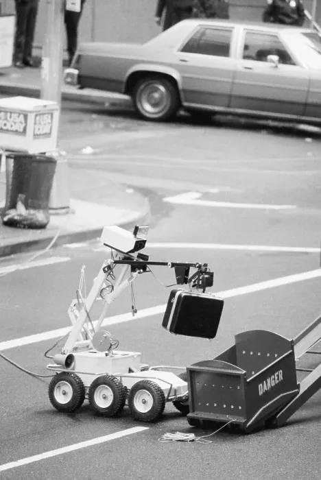 Framed Print : Police Robot Disposing of Suspicious Briefcase