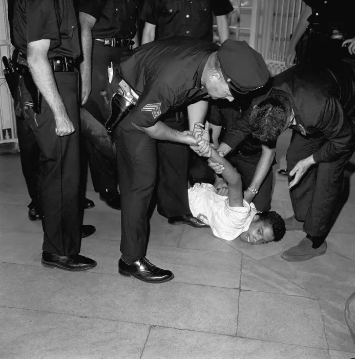 Framed Print : Police Struggle With Black Man On Ground Framed Print : Police Struggle With Black Man On Ground