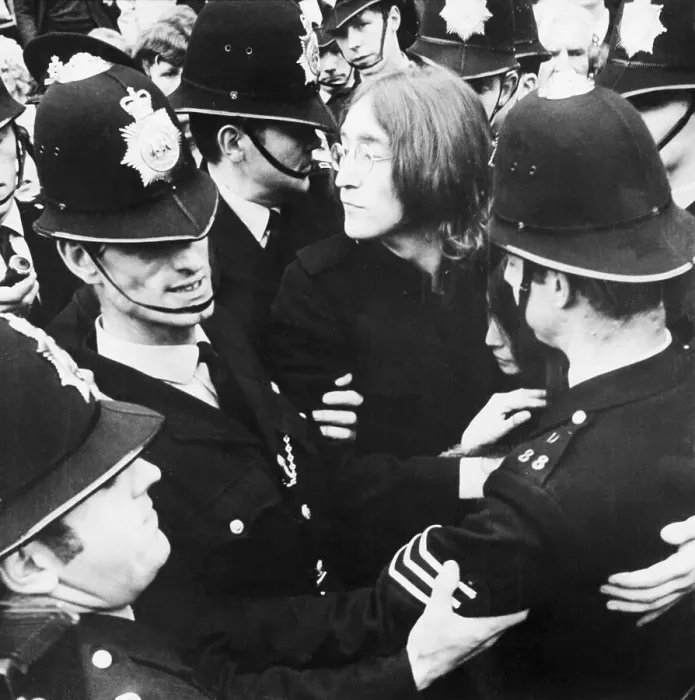 Framed Print : Police Surrounding John Lennon and Yoko Ono Framed Print : Police Surrounding John Lennon and Yoko Ono