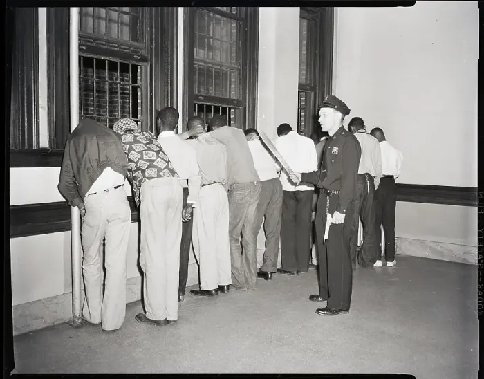 Framed Print : Policeman Arresting African-American Teens Framed Print : Policeman Arresting African-American Teens