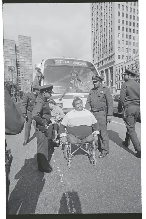 Framed Print : Policeman Arresting Disabled Man Framed Print : Policeman Arresting Disabled Man