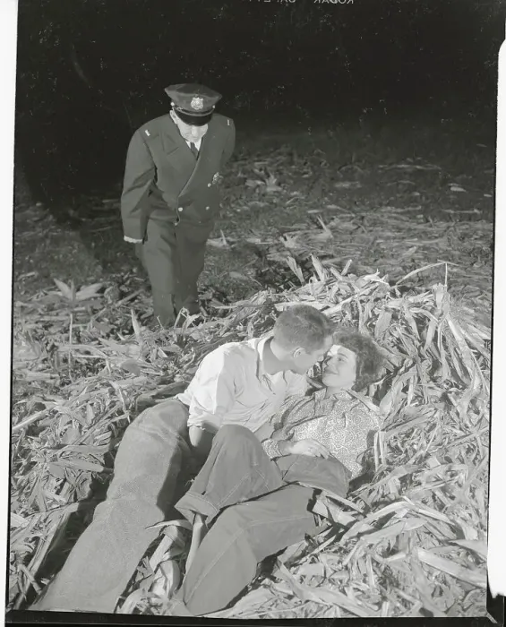 Framed Print : Policeman Catching Couple Laying in Corn Husks Framed Print : Policeman Catching Couple Laying in Corn Husks