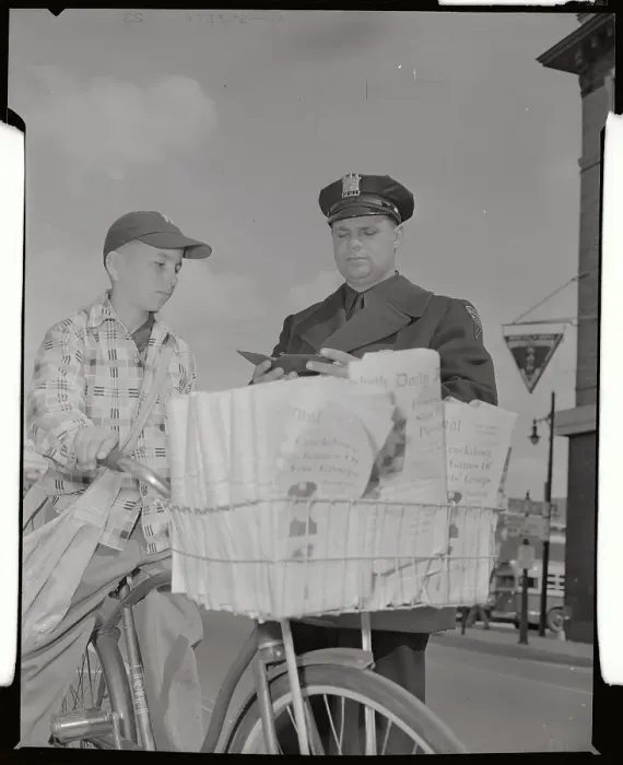 Framed Print : Policeman Checking Permit of Newsboy Delivering Papers Framed Print : Policeman Checking Permit of Newsboy Delivering Papers
