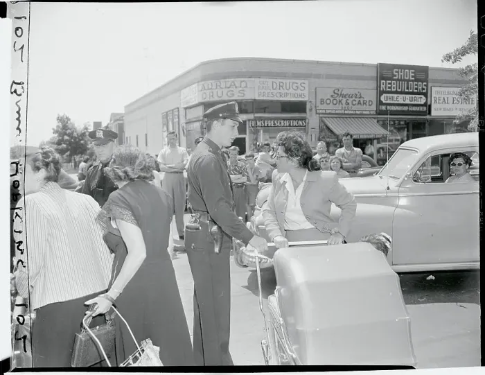Framed Print : Policeman Confronting Women One on One