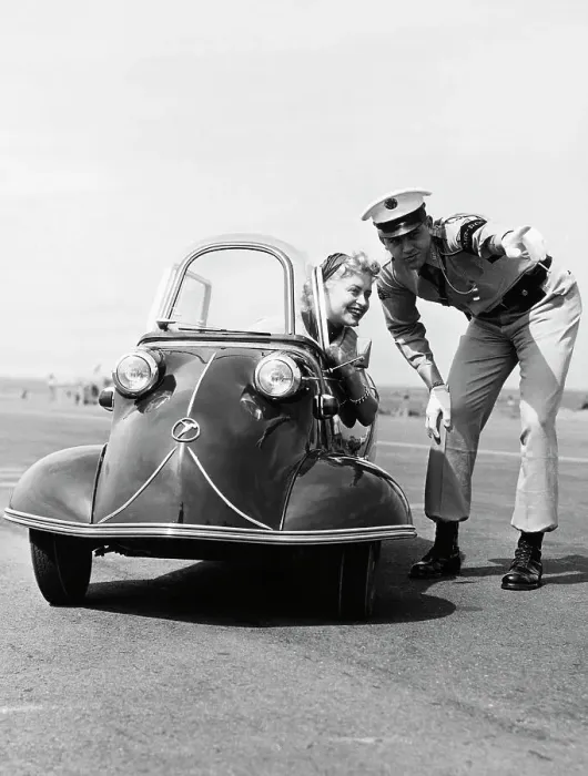 Framed Print : Policeman Directing Young Woman in Three-Wheel Car Framed Print : Policeman Directing Young Woman in Three-Wheel Car