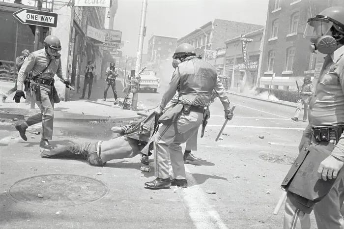 Framed Print : Policeman Dragging Away Demonstrator Framed Print : Policeman Dragging Away Demonstrator