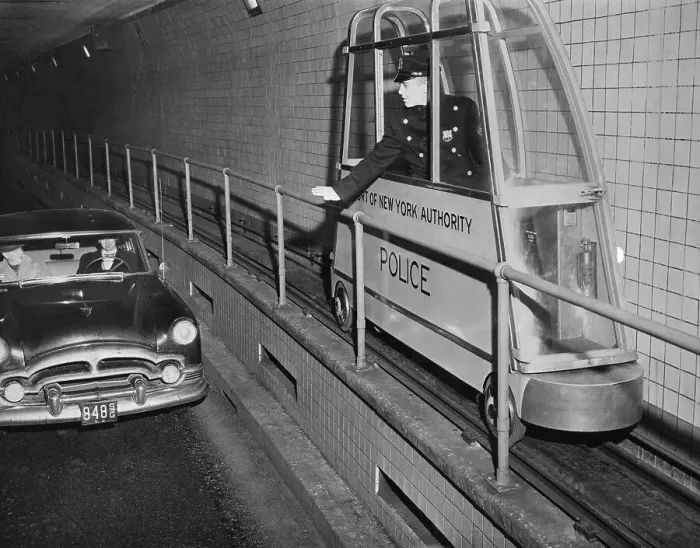 Framed Print : Policeman Driving a Catwalk Car