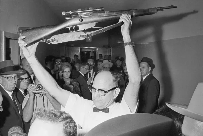 Framed Print : Policeman Holding Rifle Used in Kennedy Assassination Framed Print : Policeman Holding Rifle Used in Kennedy Assassination