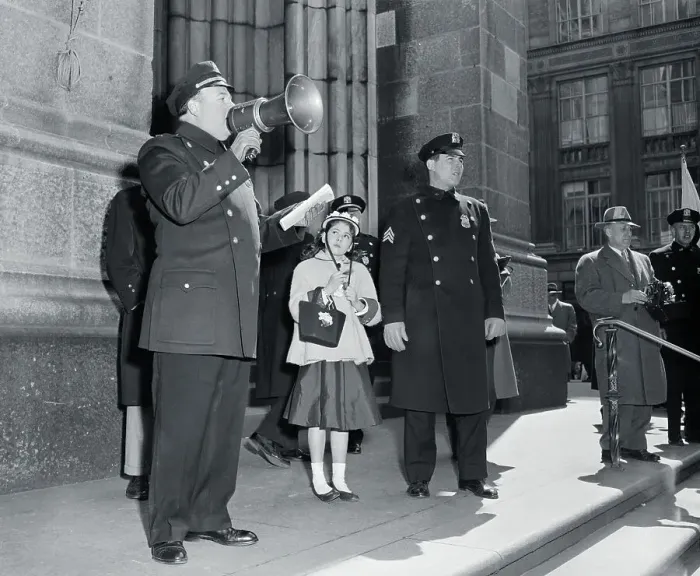Framed Print : Policeman with megaphone and lost girl (13-15 years) during Easter Parade, Fifth Avenue, New York City, New York State, USA. April 01, 1956